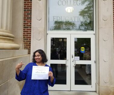 Mona Anchan poses with her Educational Psychology Program Outstanding Graduate Student Award.